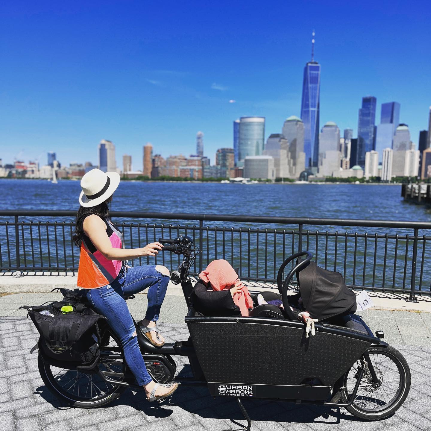 Family riding a cargo bike through NYC